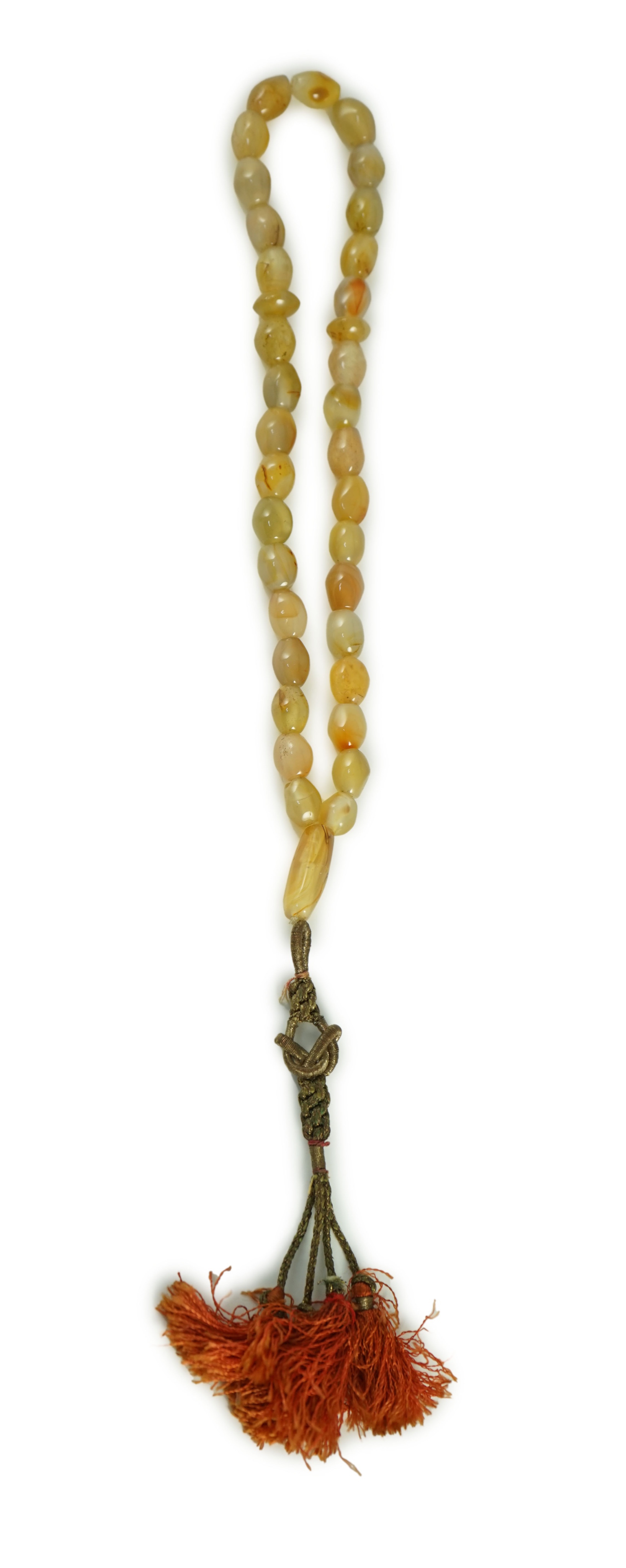 A Sino-Tibetan row of agate prayer beads, 19th century Total drop including tassel 36 cm